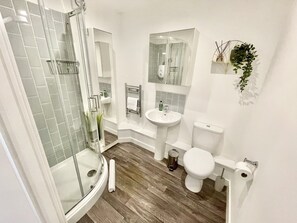 Shower, hair dryer, towels, soap