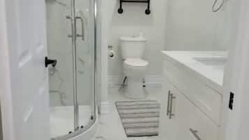 Shower, hair dryer, towels, shampoo