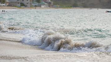 On the beach, sun-loungers, beach towels
