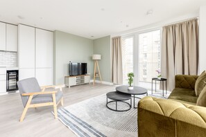 Apartment | Living area | 37-inch TV with cable channels, Netflix, streaming services - The Wembley Apartment (Wembley)