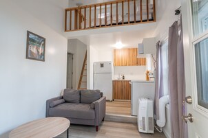 Deluxe Cottage, Sauna, Lake View | Living area | 40-inch Smart TV with digital channels, TV, DVD player