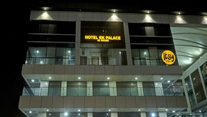 A hotel building with a sign reading "HOTEL RK PALACE AC ROOMS". - Itsy Hotels Rk Palace (Vadodara)