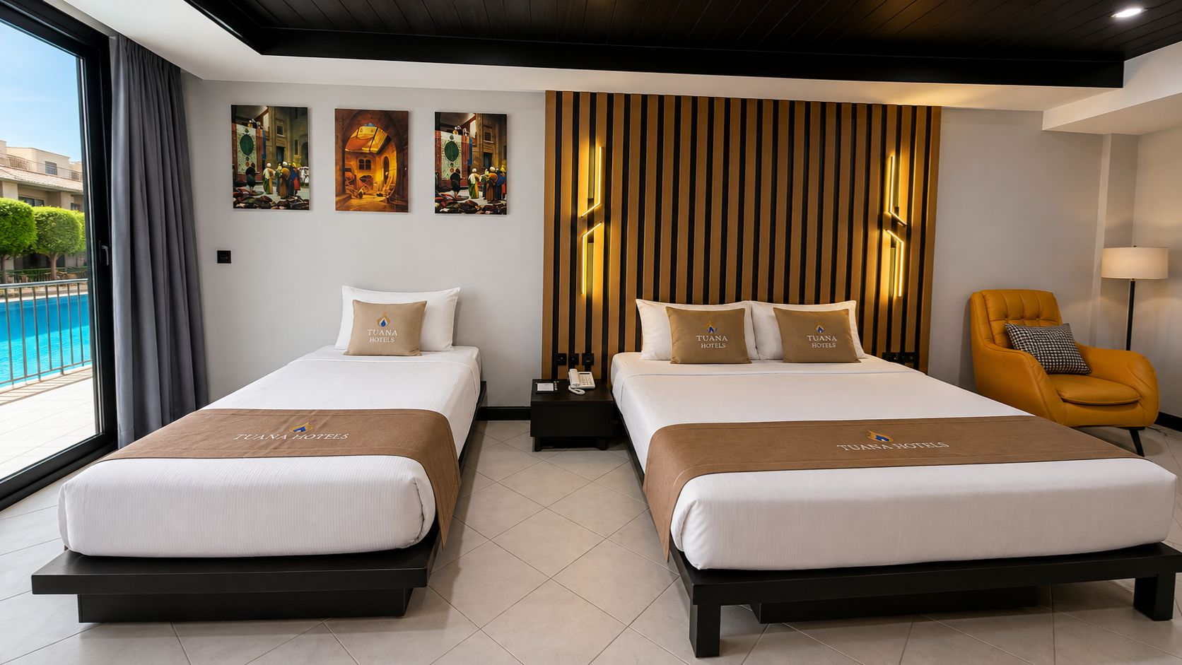 A hotel room with two beds, a view of the pool, and artwork on the wall.