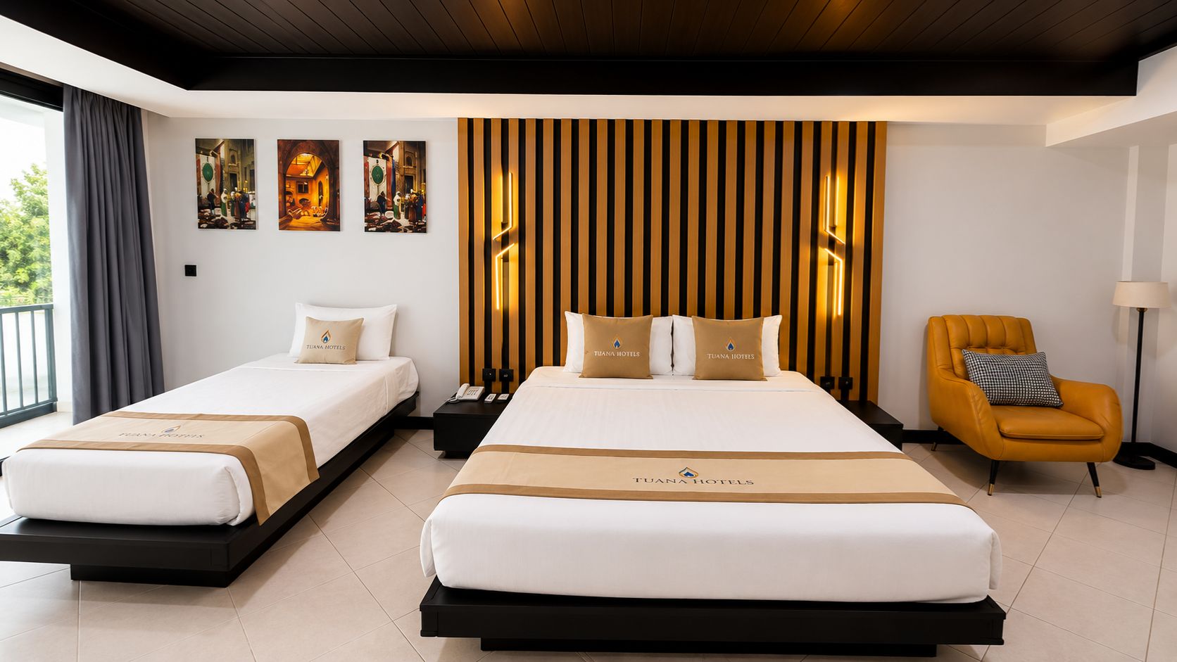 A hotel room with two beds, a modern chair, and artwork on the wall.
