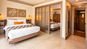A modern hotel room with a large bed, a walk-in closet, and a separate bathroom. - Tuana Hotels Casa Del Sol (Karon)