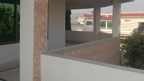 A modern building with a flat roof, large windows, and a covered outdoor area. - Impeccable 4-bed Villa in Mirpur Azad Khasmir (Mirpur)