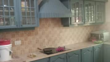 Villa | Private kitchen | Fridge, microwave, oven, stovetop