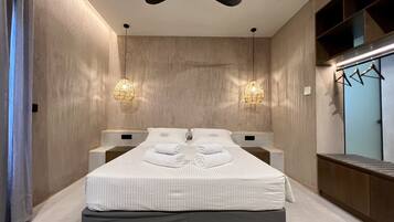 Suite junior, vistas a la playa | 2 dormitorios, ropa de cama de alta calidad, cortinas opacas