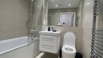 Apartment, 2 Queen Beds | Bathroom | Shower, hair dryer, towels