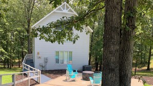 A small cabin with a wooden sign reading "344 The Tranquil Turtle." - Two Bedroom Bayside Condo (Grand Rivers)