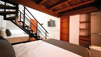 Family Room | Minibar, in-room safe, individually decorated, desk