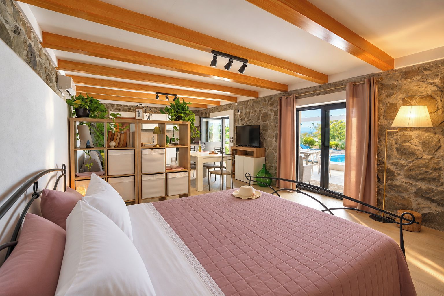 A bedroom with a bed, a desk, a television, and a view of an outdoor pool.