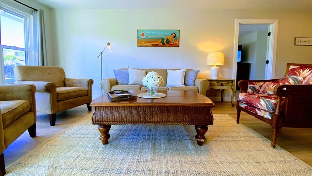 A living room with a sofa, armchairs, a coffee table, and a lamp. - Limited Time Deal 45% Discount - Best Value on LBK (Longboat Key)