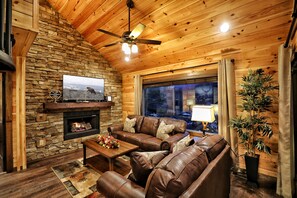 Smart TV, fireplace, DVD player, table football - 2BR Cozy Cabin Overlooking Downtown / Theater Room / Mtn & City Views + Hot Tub! (Gatlinburg)