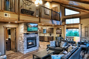 Televisión, chimenea, reproductor de DVD y futbolito 