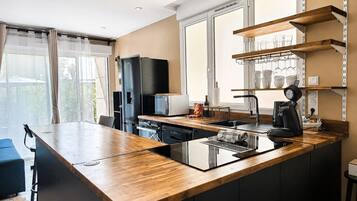 Family Studio, Garden View | Private kitchen | Espresso maker, coffee/tea maker, electric kettle, high chair