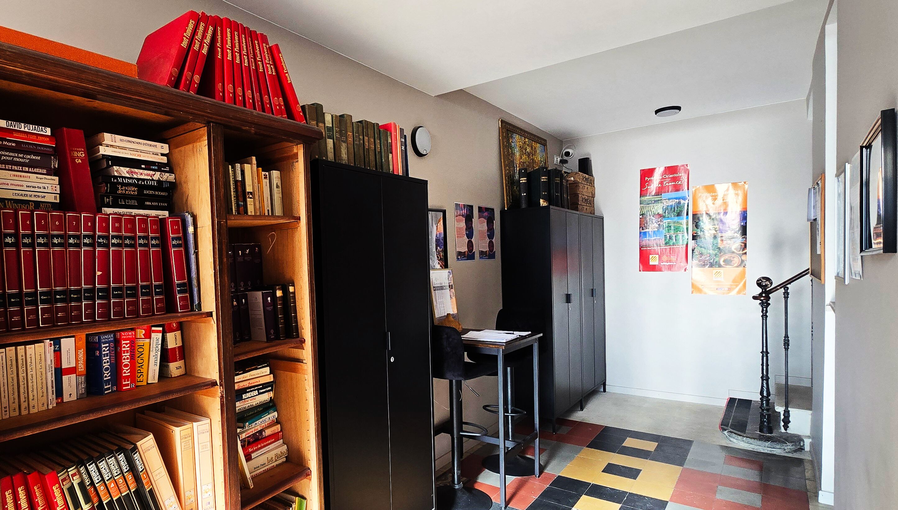 A study room with bookshelves, a desk, and a chair.