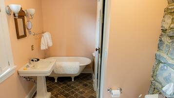 A bathroom with a sink, toilet, and bathtub.