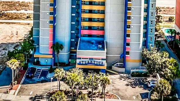 A multi-story hotel with balconies, located near a beach. - Paramount Plus/Oceanfront/New (Myrtle Beach)