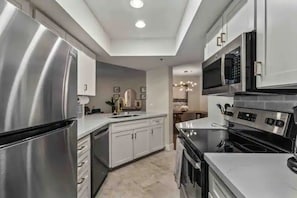 Fridge, oven, stovetop, cookware/dishes/utensils