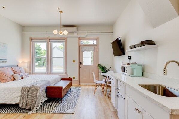 1 bedroom, desk, iron/ironing board, travel crib