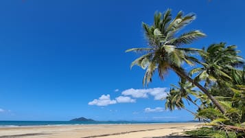 On the beach, white sand, beach towels, kayaking