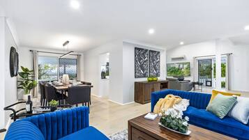 Family House, 4 Bedrooms | Living area | 6-inch LCD TV with cable channels, TV