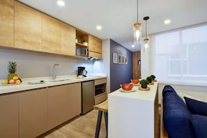 Mini-fridge, microwave, stovetop, cookware/dishes/utensils