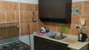 Comfort Apartment | Private kitchen | Full-sized fridge, oven, stovetop, electric kettle