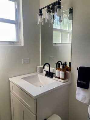 Hair dryer, towels, soap, shampoo