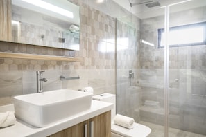 Shower, rainfall showerhead, hair dryer, towels