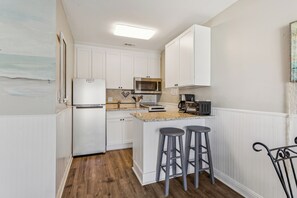 Fridge, microwave, stovetop, coffee/tea maker