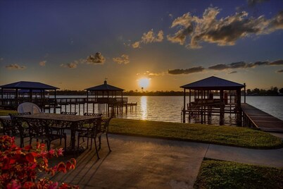 Screened porch and private pier on False River