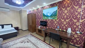 Deluxe Double Room | Living area | 48-inch LED TV with cable channels, TV