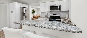 Family friendly 4-bedroom home with heated pool!