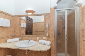 Shower, bidet, towels, soap