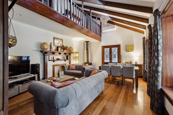 Luxury House | Living room | 52-inch Smart TV with digital channels, video game console, Netflix