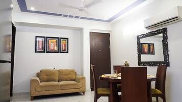 Standard Apartment | Living area | 30-inch Smart TV with cable channels