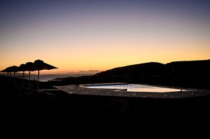 Seasonal outdoor pool, open 8:30 AM to 10:30 PM, pool umbrellas