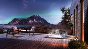 A wooden deck with a hot tub, two chairs, and a table. - NEW! Luxury Cabin in beautiful Lofoten (Nordland)