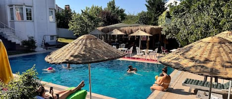 Outdoor pool, pool umbrellas, sun loungers