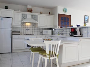 Coffee/tea maker, fridge, microwave, oven