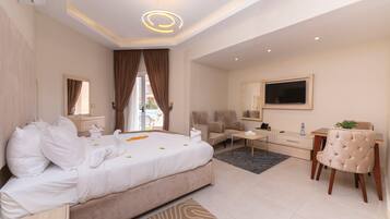 Comfort Studio, Poolside | Living area | 42-inch LED TV with satellite channels, TV