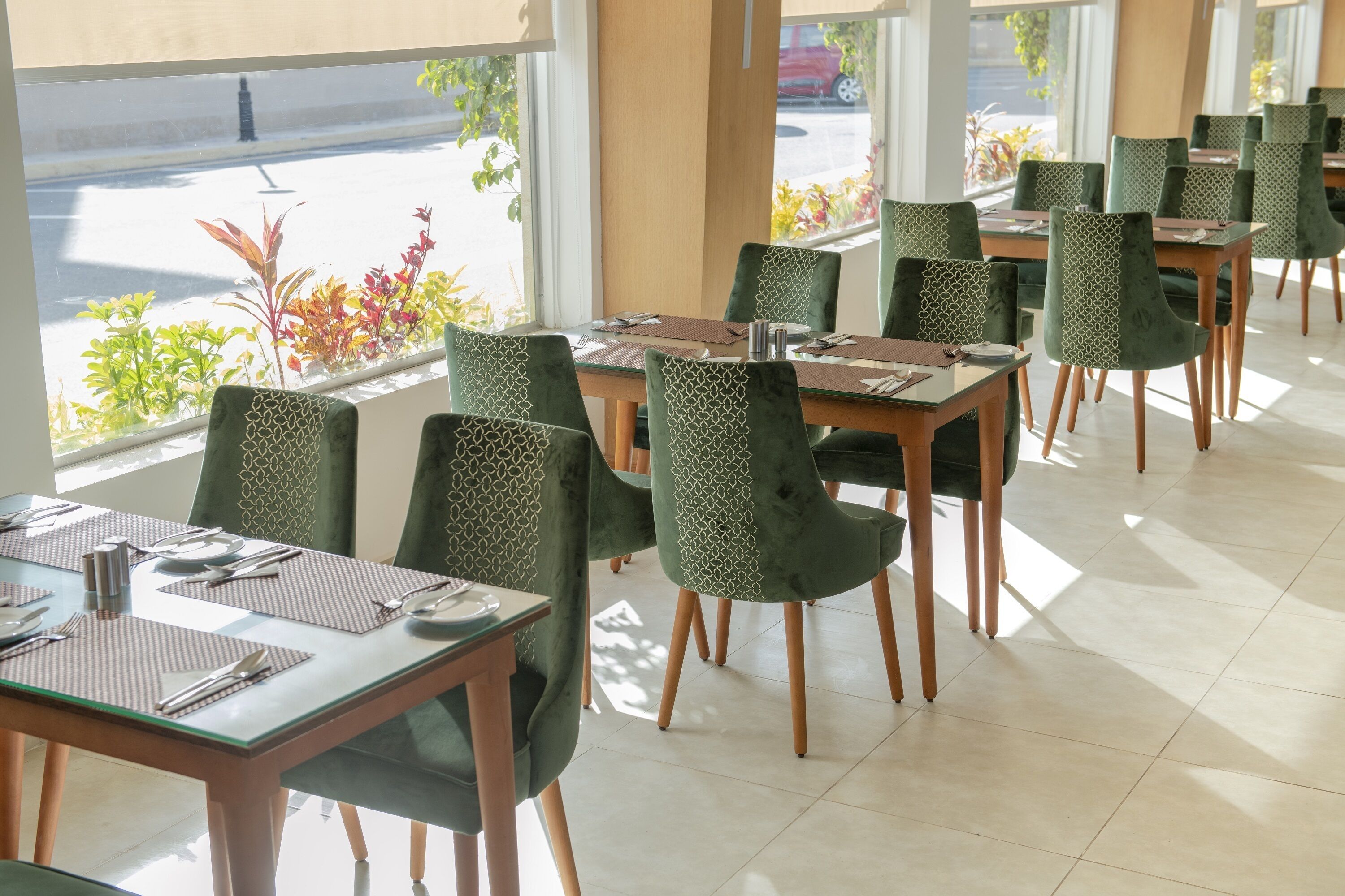 A restaurant with tables and chairs arranged for dining.