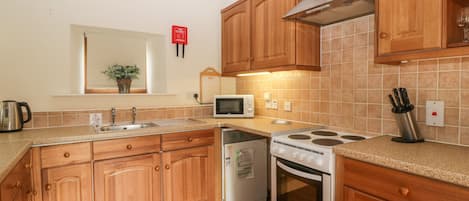 Fridge, electric kettle, toaster, cookware/dishes/utensils
