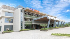 A modern building with a prominent 'FOX HARRIS' sign, large windows, and a covered entrance area. - FOX Harris Hotel & Conventions Banjarnegara (Banjarnegara)