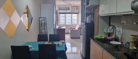 Fridge, microwave, electric kettle, cookware/dishes/utensils