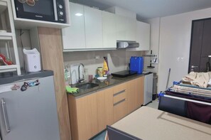 Fridge, microwave, electric kettle, cookware/dishes/utensils