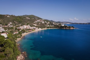 On the beach, sun-loungers, beach towels