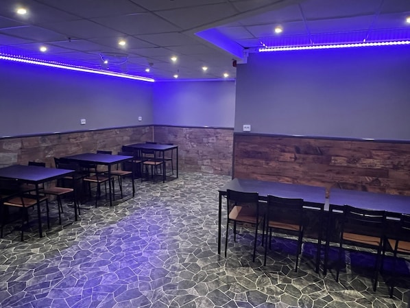 A restaurant with tables and chairs arranged in a casual setting. - Grad Hotel and Hostel (Stockholm)